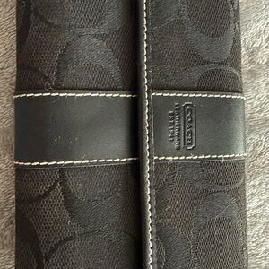 Coach Black Leather Wallet with Embossed Detailing
